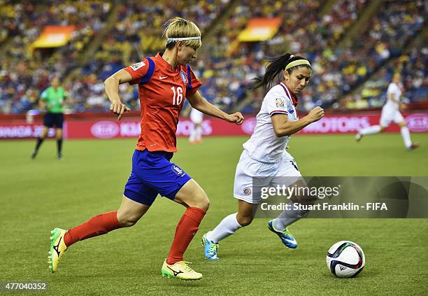 Yumi Kang of Korea is challenged by Lixy Rodriguez of Costa Rica during the FIFA Women's Wolrd Cup Group E match between Korea Republic and Costa...