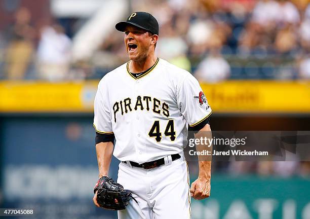 Tony Watson of the Pittsburgh Pirates reacts after getting out of a bases-loaded jam in the eighth inning against the Philadelphia Phillies during...