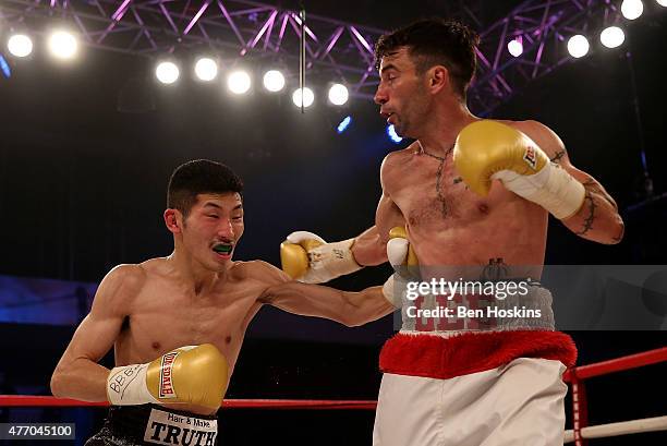 Lee Haskins of Great Britain and Ryosuke Iwasa of Japan exchange blows during their Interim IBF World Bantamweight Title Fight at Action Indoor...