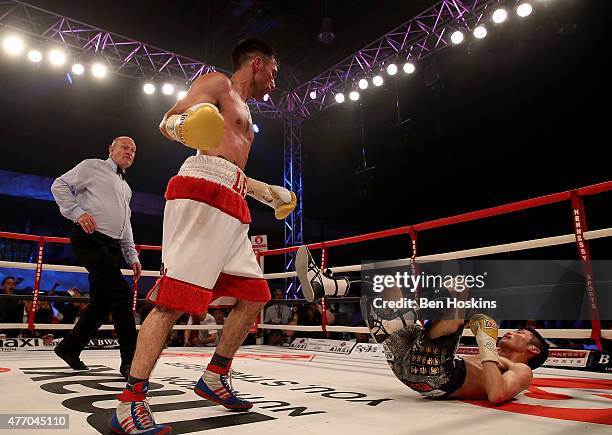 Lee Haskins of Great Britain knocks down Ryosuke Iwasa of Japan during their Interim IBF World Bantamweight Title Fight at Action Indoor Sports Arena...