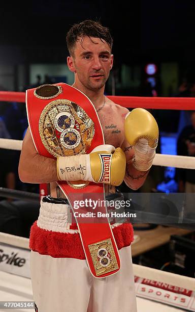 Lee Haskins of Great Britain celebrates with the IBF World Bantamweight title belt after defeating Ryosuke Iwasa of Japan in their Interim IBF World...