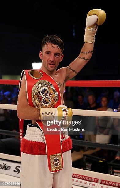 Lee Haskins of Great Britain celebrates with the IBF World Bantamweight title belt after defeating Ryosuke Iwasa of Japan in their Interim IBF World...