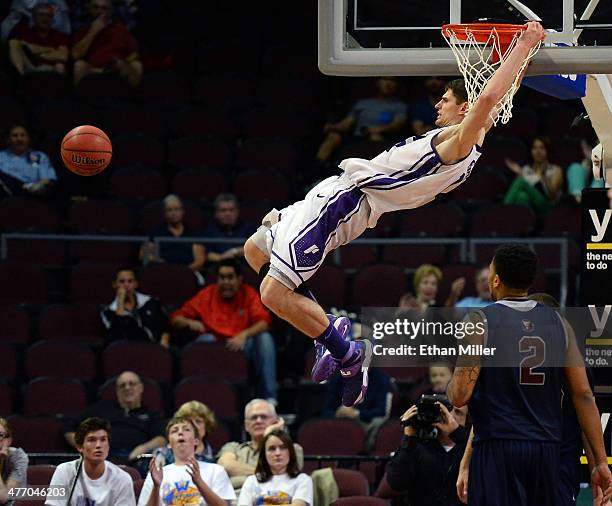 Thomas van der Mars of the Portland Pilots dunks against the Loyola Marymount Lions during an opening-round game of the West Coast Conference...