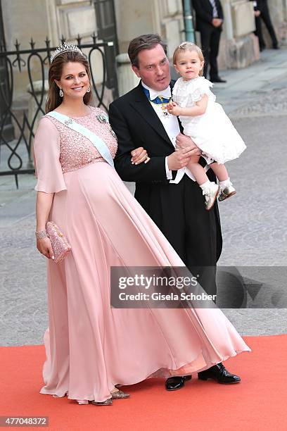 Princess Madeleine of Sweden, her husband Christopher O'Neill and their daughter Princess Leonore attend the royal wedding of Prince Carl Philip of...