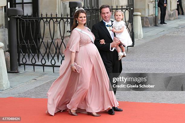 Princess Madeleine of Sweden, her husband Christopher O'Neill and their daughter Princess Leonore attend the royal wedding of Prince Carl Philip of...