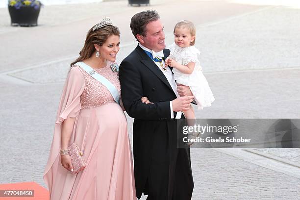 Princess Madeleine of Sweden, her husband Christopher O'Neill and their daughter Princess Leonore attend the royal wedding of Prince Carl Philip of...