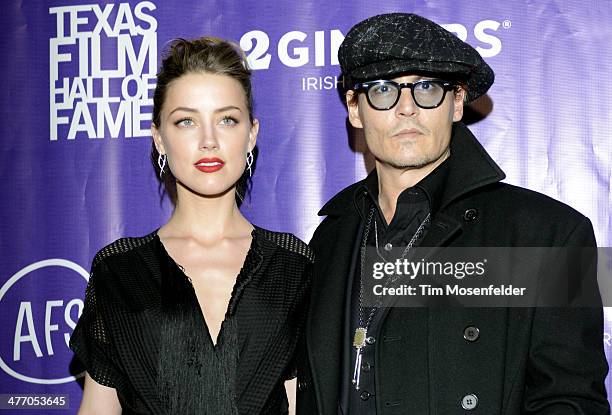 Amber Heard and Johnny Depp arrive at the 2014 Texas Film Awards presented by the Austin Film Society at Austin Studios on March 6, 2014 in Austin,...