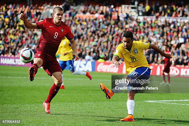 Jorge of Brazil kicks the ball past Andre Silva of Portugal during the FIFA U-20 World Cup New Zealand 2015 quarter final match between Brazil and...