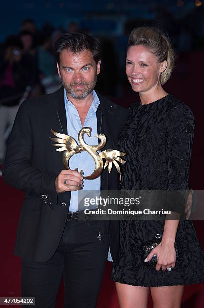 Clovis Cornillac awarded best first movie poses with Lilou Frogli during the closing ceremony of the 29th Cabourg Film Festival on June 13, 2015 in...