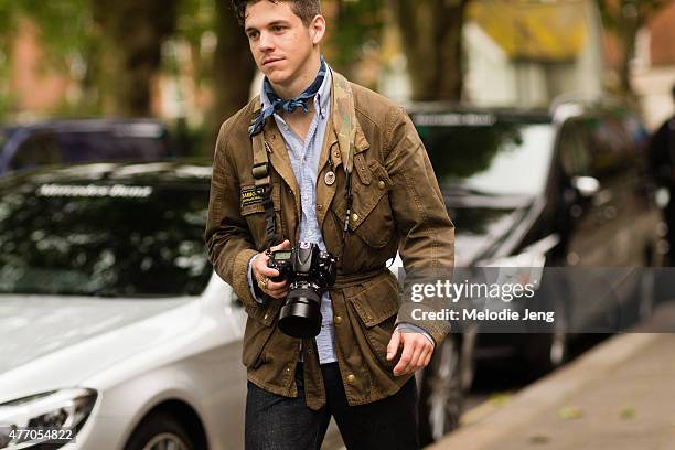 Photographer Robert Spangle wears a Barbour jacket during The London Collections Men SS16 at on June 13, 2015 in London, England.