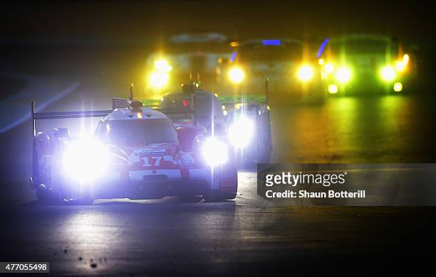 Porsche Team driven by Timo Bernhard, Mark Webber and Brendon Hartley during the Le Mans 24 Hour race at the Circuit de la Sarthe on June 13, 2015 in...