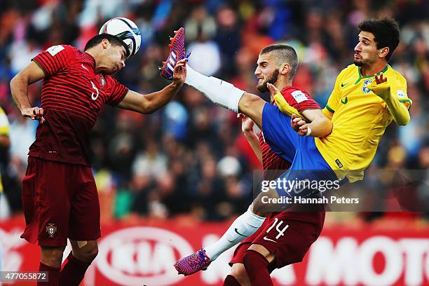 Rafa of Portugal heads the ball as Gabriel Boschilia of Brazil defends during the FIFA U-20 World Cup New Zealand 2015 quarter final match between...