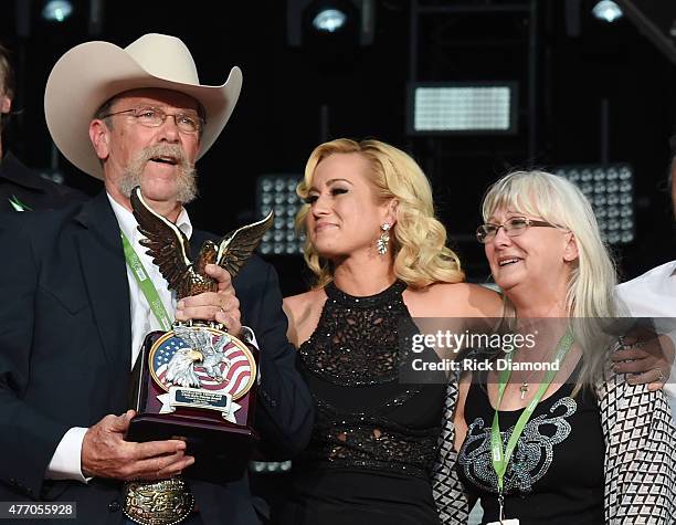 Wayne Kyle and Deby Kyle, parents of United States Navy SEAL sniper Chris Kyle, speak onstage with singer Kellie Pickler during the 2015 CMA Festival...