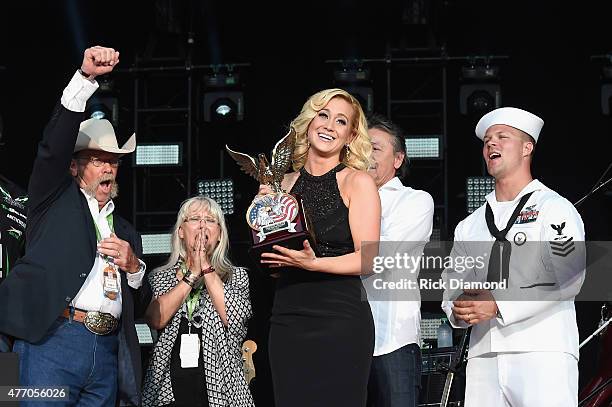 Wayne Kyle and Deby Kyle, parents of United States Navy SEAL sniper Chris Kyle, speak onstage with singer Kellie Pickler during the 2015 CMA Festival...