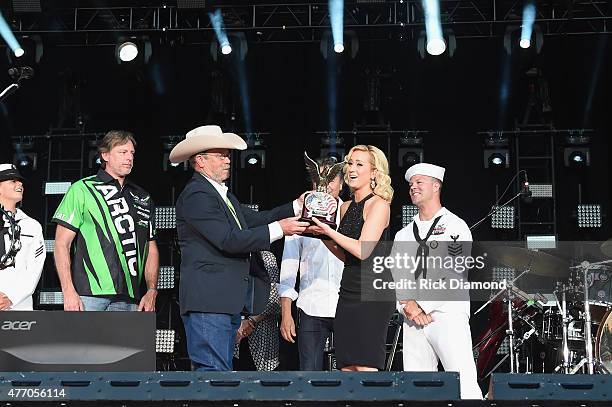 Wayne Kyle father of United States Navy SEAL sniper Chris Kyle, speaks onstage with singer Kellie Pickler during the 2015 CMA Festival on June 13,...