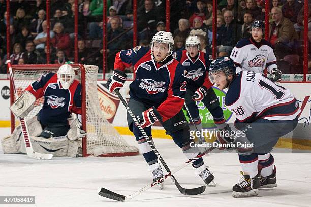 Dylan Sadowy of the Saginaw Spirit battles against Eric Diodati of the Windsor Spitfires on March 6, 2014 at the WFCU Centre in Windsor, Ontario,...
