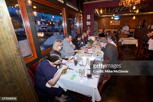 Guest, chefs and champs eat after preparation at the Milwaukee Recipe Refresh Challenge at Il Mito Restaurant on March 06, 2014 in Wauwatosa,...