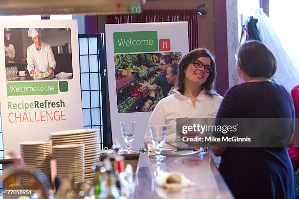 Bria Day talks to guests before the start of the Milwaukee Recipe Refresh Challenge at Il Mito Restaurant on March 06, 2014 in Wauwatosa, Wisconsin.