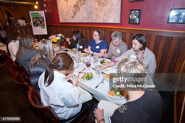 Guest, chefs and champs eat after preparation at the Milwaukee Recipe Refresh Challenge at Il Mito Restaurant on March 06, 2014 in Wauwatosa,...