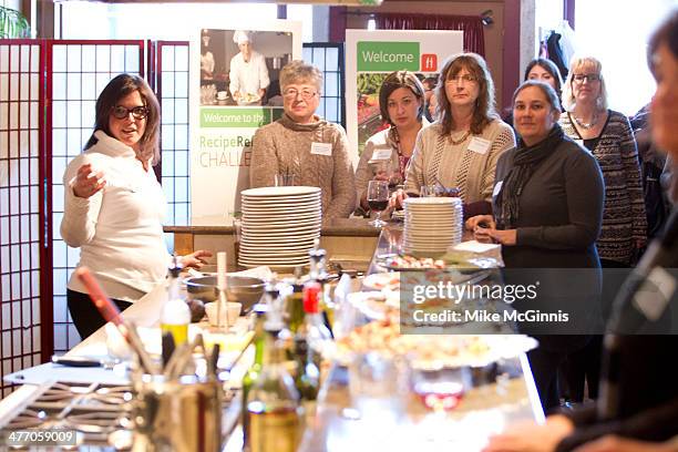 Bria Day speaks to the guests, champs and chefs before the start of the Milwaukee Recipe Refresh Challenge at Il Mito Restaurant on March 06, 2014 in...