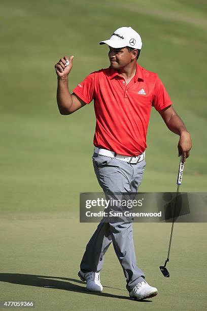 Fabian Gomez of Argentina reacts to a par putt on the 18th hole during round three of the FedEx St. Jude Classic at TPC Southwind on June 13, 2015 in...
