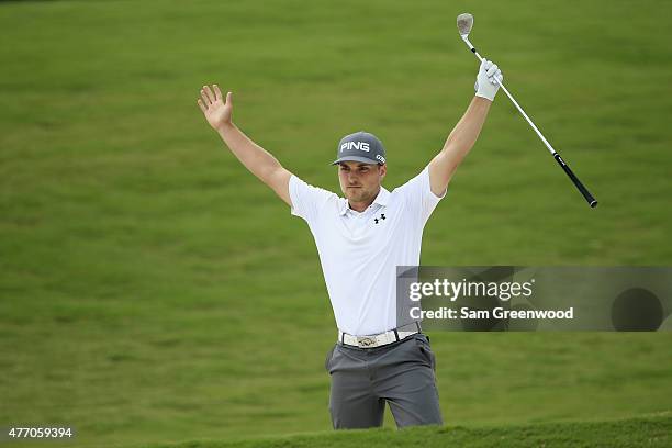 Austin Cook reacts after a birdie shot from the bunker on the 8th hole during round three of the FedEx St. Jude Classic at TPC Southwind on June 13,...