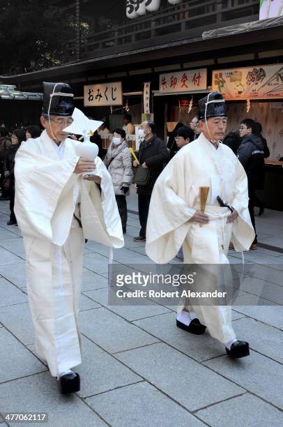 Shinto priests participate in a ceremony at the Meiji-Jingu shrine in the Harajuku district of Tokyo. The shrine and surrounding gardens are...