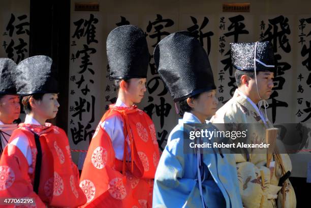 Shinto priests prepare to participate in a ceremony at the Meiji-Jingu shrine in the Harajuku district of Tokyo. The shrine and surrounding gardens...