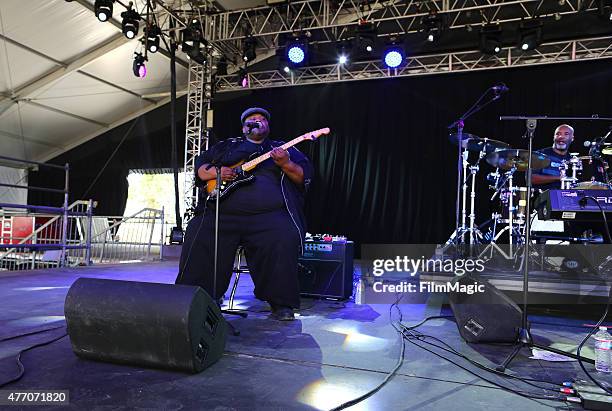 Musicians Derwin "Big D" Perkins and Jellybean of Jon Cleary and the Absolute Monster Gentlemen perform onstage at That Tent during Day 3 of the 2015...