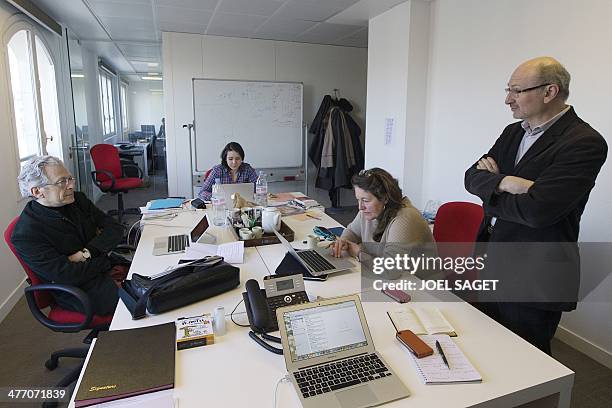 French journalists Eric Fottorino and Laurent Greilsamer pose in their office on March 6, 2014 in Paris. . The former director of the French...