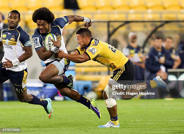 Henry Speight of the Brumbies is tackled by Alapati Leiua of the Hurricanes during the round four Super Rugby match between the Hurricanes and the...