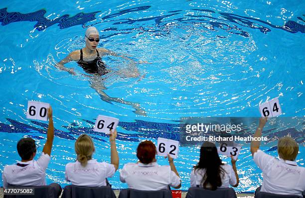 Verena Breit of Austria recieves her makes from the judges in the Figures Synchronised Swimming during day two of the Baku 2015 European Games at...
