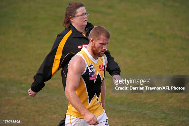 North Melbourne listed player Leigh Adams heads to the rooms after receiving a head knock while playing for Werribee during the round nine VFL match...