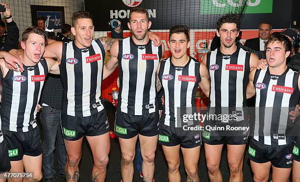 Tom Langdon, Jesse White, Travis Cloke, Marley Williams, Scott Pendlebury and Ben Kennedy of the Magpies sing the song in the rooms after winning the...