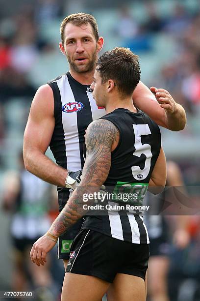 Travis Cloke of the Magpies is congratulated by Jamie Elliott after kicking a goal during the round 11 AFL match between the Collingwood Magpies and...