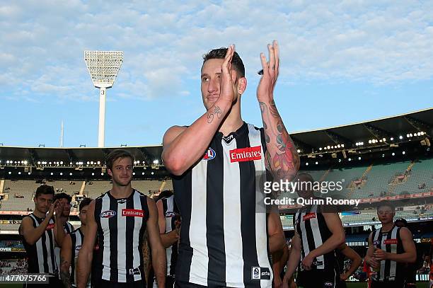 Jesse White of the Magpies walks off the field in his 100th game during the round 11 AFL match between the Collingwood Magpies and the Greater...