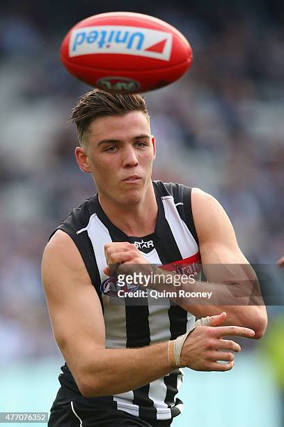 Paul Seedsman of the Magpies handballs during the round 11 AFL match between the Collingwood Magpies and the Greater Western Sydney Giants at...