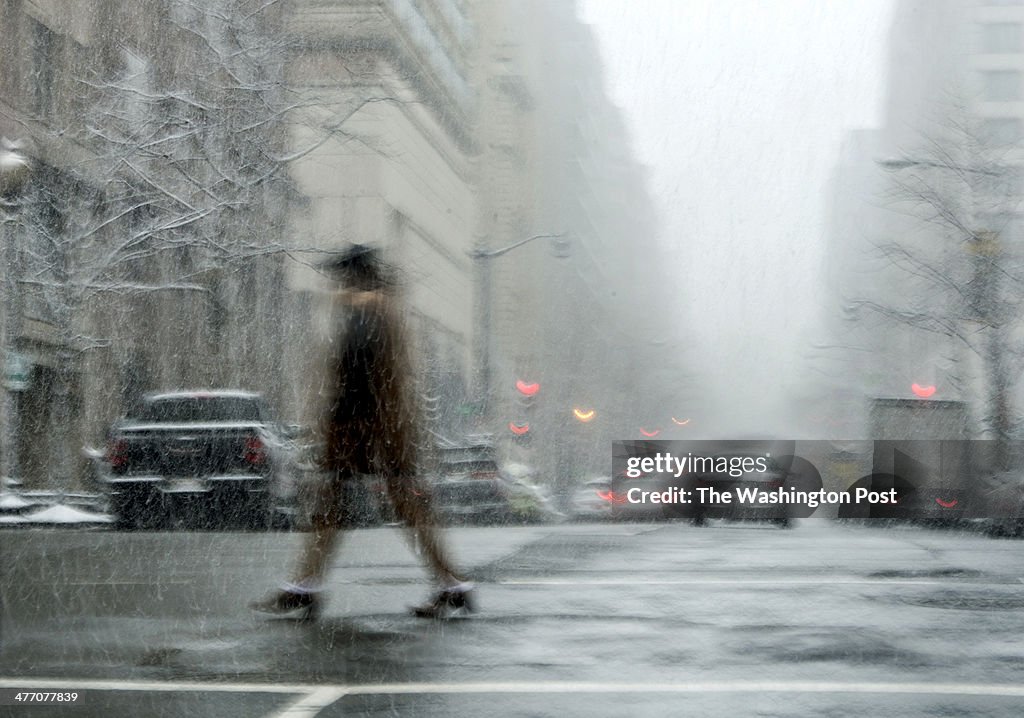 WASHINGTON, DC  FEBRUARY 25: A pedestrian crosses a downtown st