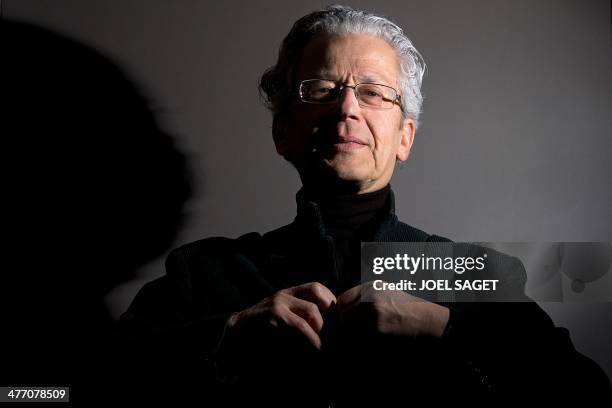 French journalist and former right-hand person to the director of the French newspaper "Le Monde", Laurent Greilsamer poses in his office on March 6,...