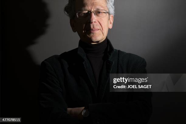 French journalist and former right-hand person to the director of the French newspaper "Le Monde", Laurent Greilsamer poses in his office on March 6,...
