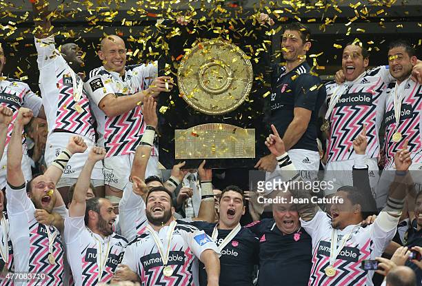 Sergio Parisse and Pierre Rabadan of Stade Francais lift the 'Bouclier de Brennus' during the trophy ceremony following the Top 14 Final between ASM...