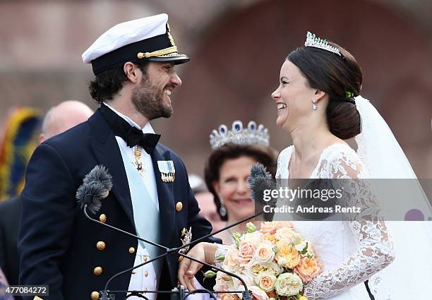 Prince Carl Philip of Sweden and HRH Princess Sofia, Duchess of Varmlands salute the crowd after their marriage ceremony on June 13, 2015 in...