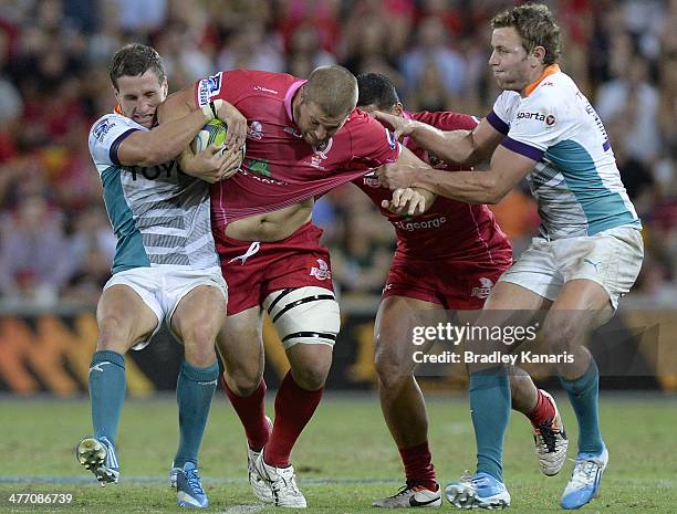 James Slipper of the Reds attempts to break through the defence during the round four Super Rugby match between Queensland Reds and the Cheetahs at...