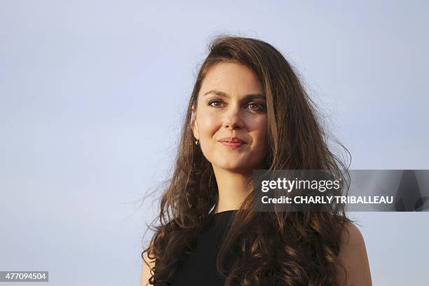 French actress Julia Faure poses on the red carpet on June 13, 2015 during the Cabourg Romantic Film Festival in Cabourg, northwestern France. AFP...