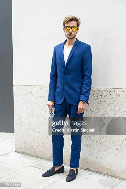 Fashion blogger and model Ruben Ramos wears Hawkers sunglasses, Zara suit and shoes and Ralph Lauren T shirt on day 2 of London Collections: Men on...