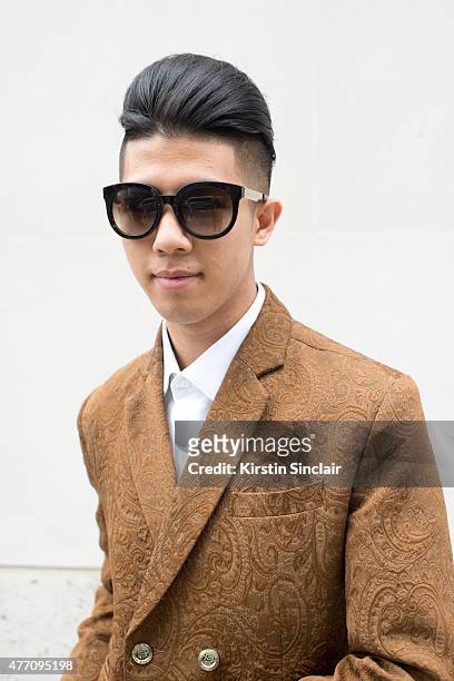 Fashion blogger & Lifestyle Photographer Toni Tran wears Marc Jacobs sunglasses, bespoke Fashitects suit, Collarclub London shirt and on day 2 of...