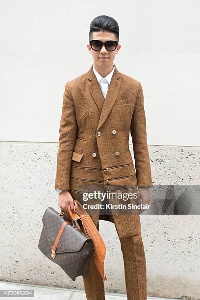 Fashion blogger & Lifestyle Photographer Toni Tran wears Marc Jacobs sunglasses, Louis Vuitton bag, vintage scarf, bespoke Fashitects suit,...