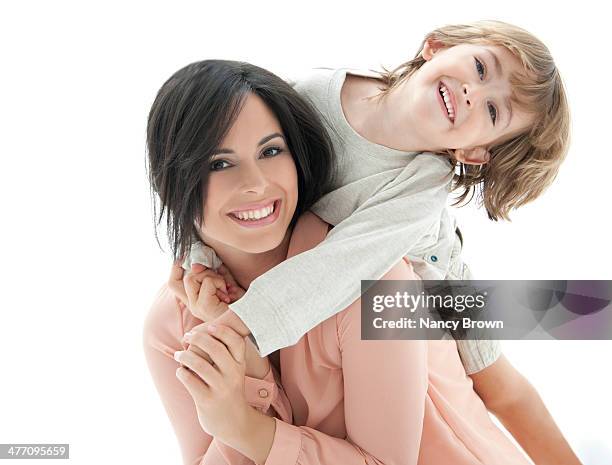 latin mother and son happy head shot. - family studio shot stock pictures, royalty-free photos & images