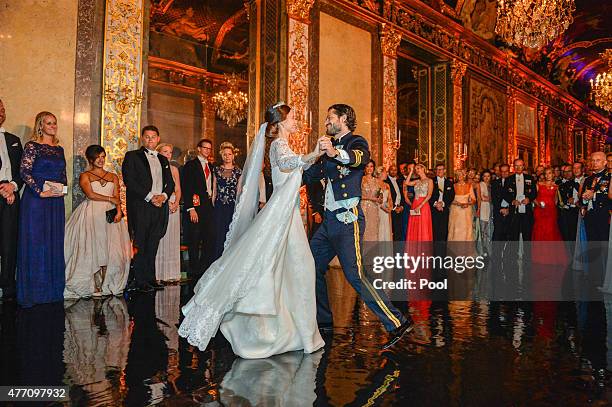 Prince Carl Philip of Sweden dances with his new wife Princess Sofia of Sweden at their marriage ceremony at The Royal Palace on June 13, 2015 in...