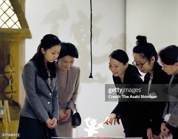 Princess Kiko and her daughter Princess Kako of Akishino visit a Chinese traditional paper cutout exhibition at Carrot Tower on March 7, 2014 in...